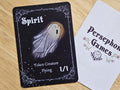 Illustrated 1/1 flying spirit token card featuring a sheet covered ghost flying through a starry night.