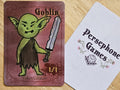 Illustrated goblin token card featuring a green goblin brandishing a worn sword