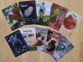 Collection of 10 MTG Token cards fanned out on a wooden surface