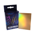 Box of Prismatic Defender holographic card sleeves with a sample sleeve displayed.
