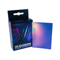 Box of Prismatic Defender holographic card sleeves with a sample sleeve displayed.
